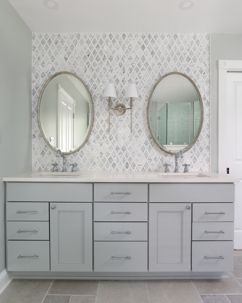 Example of a large classic master gray tile and ceramic tile ceramic tile, gray floor, double-sink and wainscoting bathroom design in Baltimore with recessed-panel cabinets, gray cabinets, a two-piece toilet, green walls, an undermount sink, quartz countertops, a hinged shower door, white countertops, a niche and a freestanding vanity