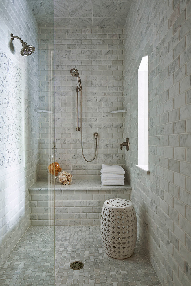Photo of a traditional bathroom in Minneapolis with an alcove shower, gray tile, marble and a shower seat.