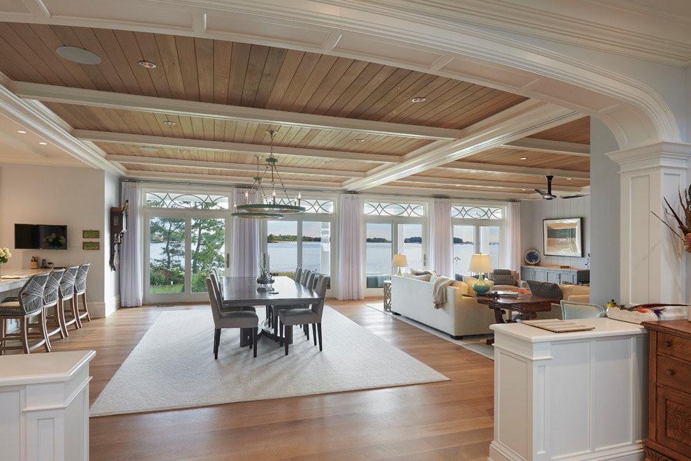 Design ideas for an expansive traditional open plan dining in New York with blue walls, medium hardwood floors and brown floor.