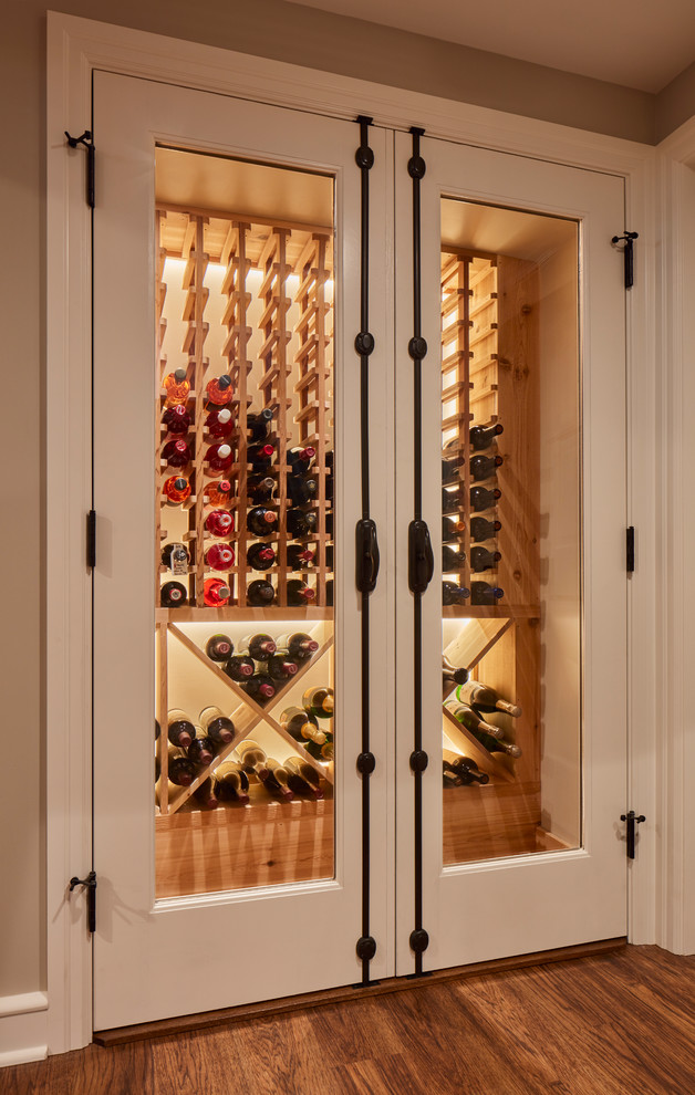 Design ideas for a traditional wine cellar in Milwaukee with storage racks and vinyl floors.