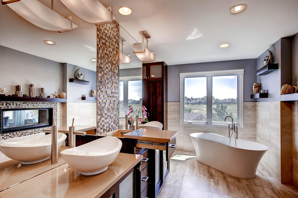 Large contemporary master bathroom in Denver with a vessel sink, shaker cabinets, medium wood cabinets, engineered quartz benchtops, a freestanding tub, an open shower, a two-piece toilet, beige tile, ceramic tile, blue walls and ceramic floors.