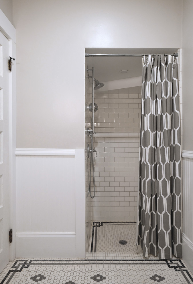 Example of a mid-sized classic white tile and subway tile ceramic tile and white floor bathroom design in San Francisco with a two-piece toilet, beige walls and a pedestal sink