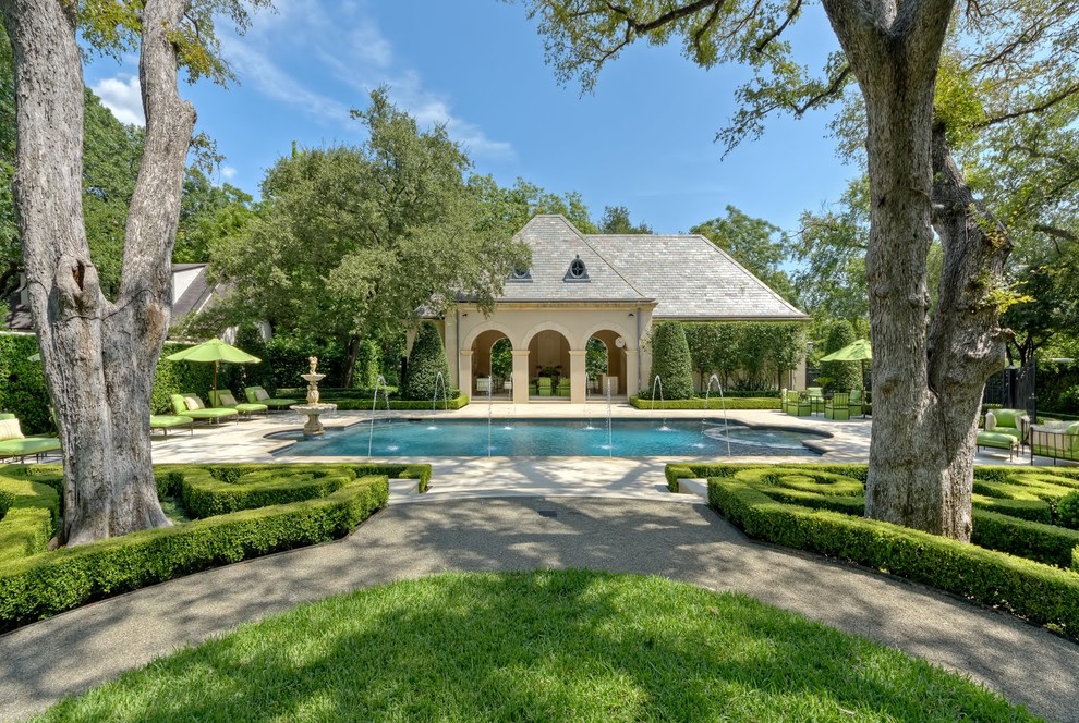 Design ideas for a traditional rectangular pool in Dallas with a water feature.