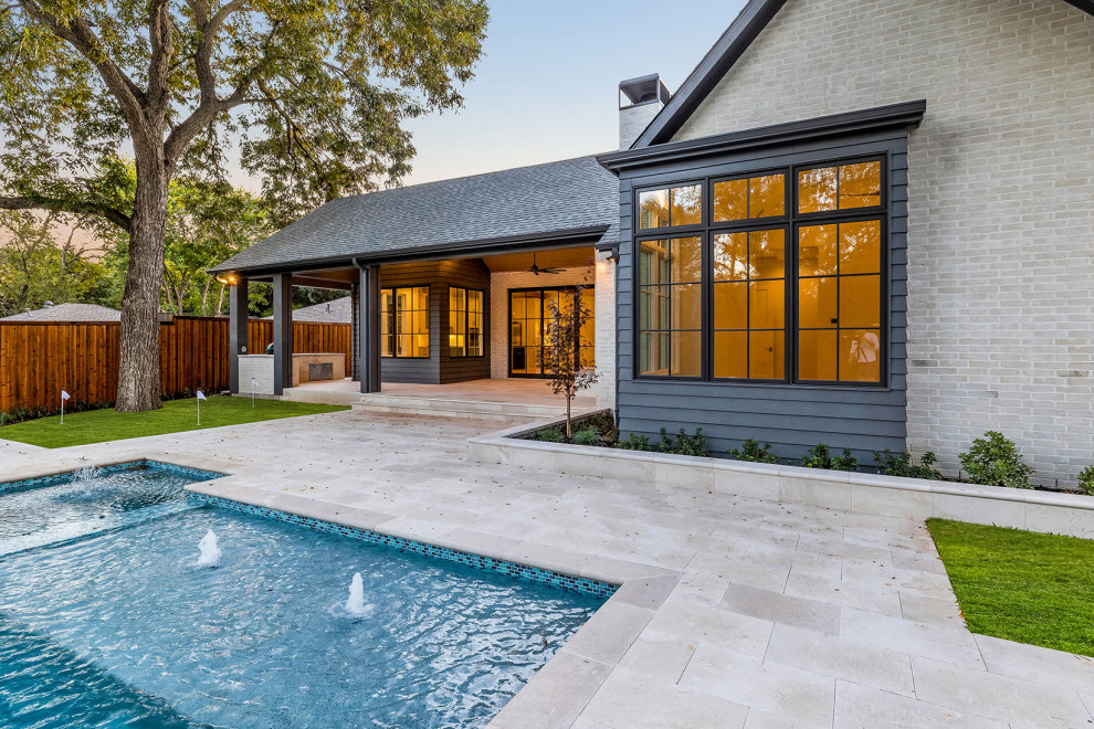 Transitional pool photo in Dallas