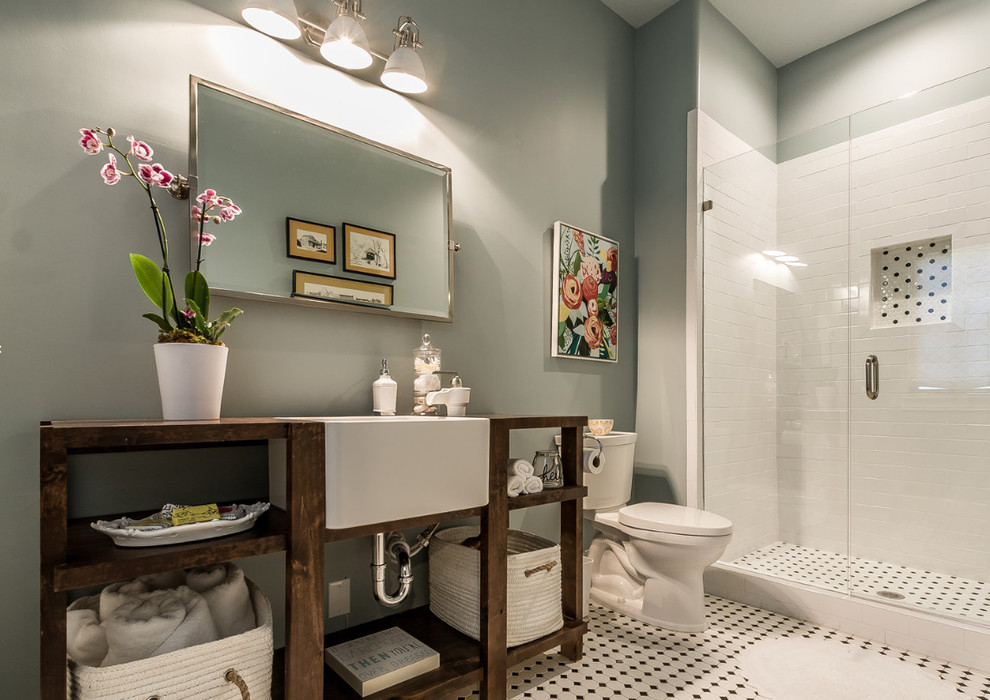 Photo of a large modern 3/4 wet room bathroom in Dallas with open cabinets, brown cabinets, a two-piece toilet, white tile, subway tile, grey walls, mosaic tile floors, a drop-in sink, wood benchtops, multi-coloured floor, a hinged shower door, brown benchtops, a niche, a single vanity, a freestanding vanity and vaulted.
