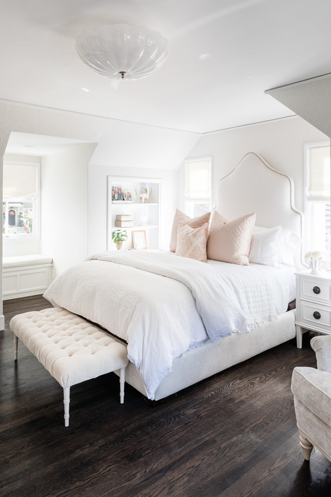Inspiration for a transitional bedroom in Sacramento with white walls, dark hardwood floors and brown floor.