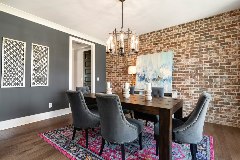 Photo of a transitional separate dining room in Nashville with grey walls, medium hardwood floors, no fireplace and brown floor.