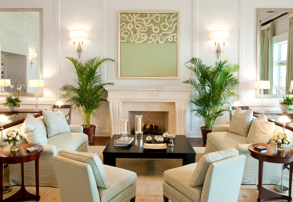 Design ideas for a traditional living room in Tampa with white walls and a standard fireplace.