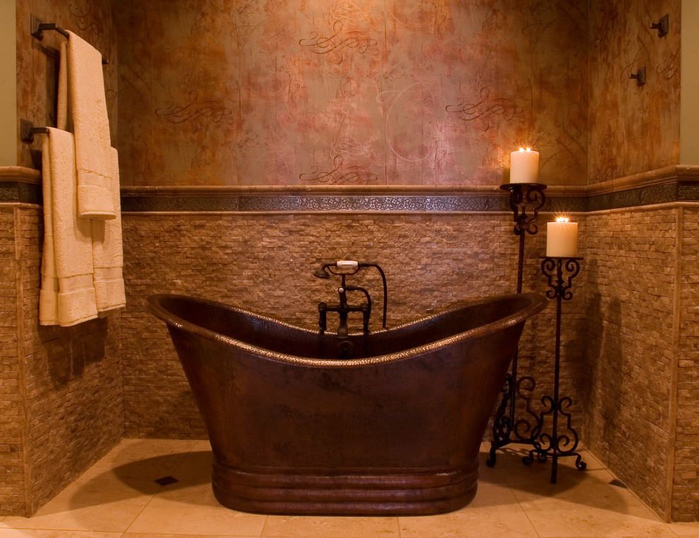 This is an example of a contemporary bathroom in New Orleans with a freestanding tub and brown walls.