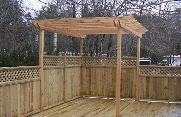Example of a backyard balcony deck design with a pergola
