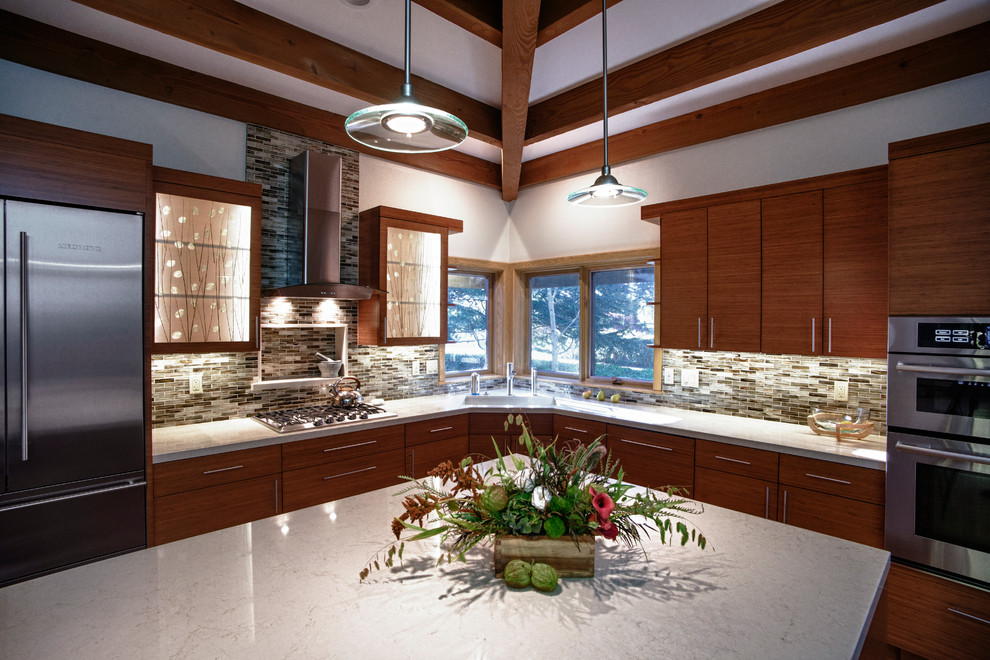 Inspiration for a large asian l-shaped eat-in kitchen in San Francisco with an undermount sink, shaker cabinets, medium wood cabinets, marble benchtops, multi-coloured splashback, glass sheet splashback, stainless steel appliances, light hardwood floors and with island.