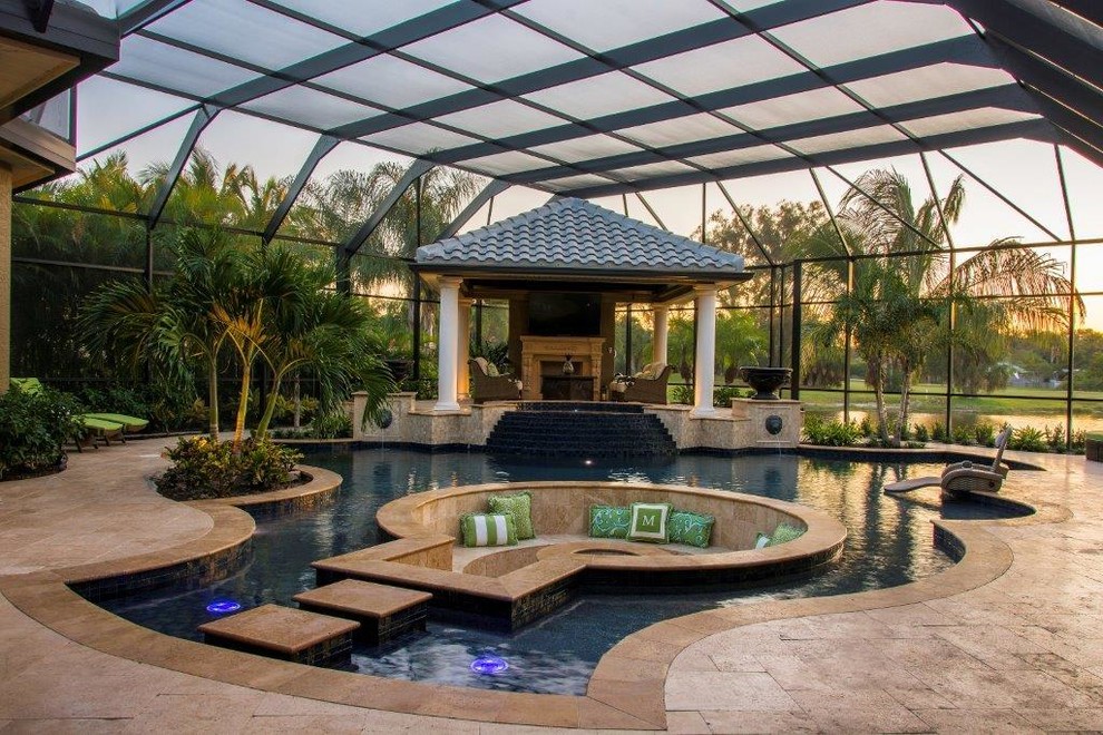 Inspiration for an expansive contemporary backyard kidney-shaped natural pool in Tampa with a hot tub and tile.