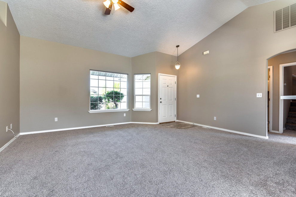 Small traditional open concept family room in Boise with beige walls, carpet, no fireplace and no tv.