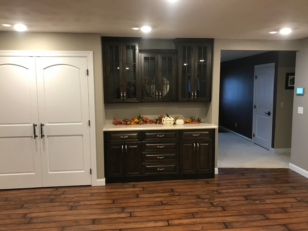 Inspiration for a timeless kitchen remodel with raised-panel cabinets, laminate countertops and stainless steel appliances