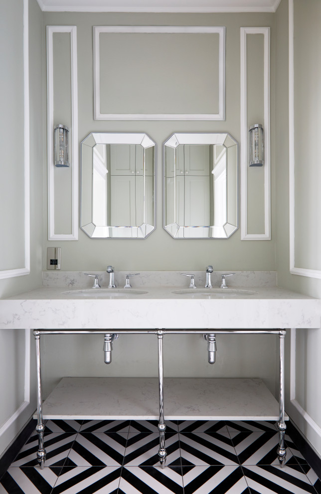 Inspiration for a mid-sized transitional master bathroom in London with a drop-in tub, a corner shower, porcelain tile, green walls, porcelain floors, marble benchtops, black floor, a sliding shower screen, a double vanity, a freestanding vanity and panelled walls.