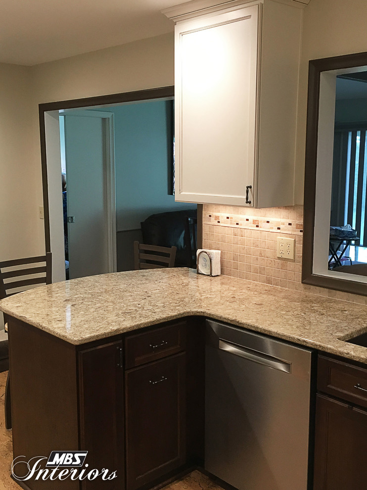 Example of a small transitional u-shaped eat-in kitchen design with an undermount sink, recessed-panel cabinets, white cabinets, quartzite countertops, multicolored backsplash, mosaic tile backsplash, stainless steel appliances and no island