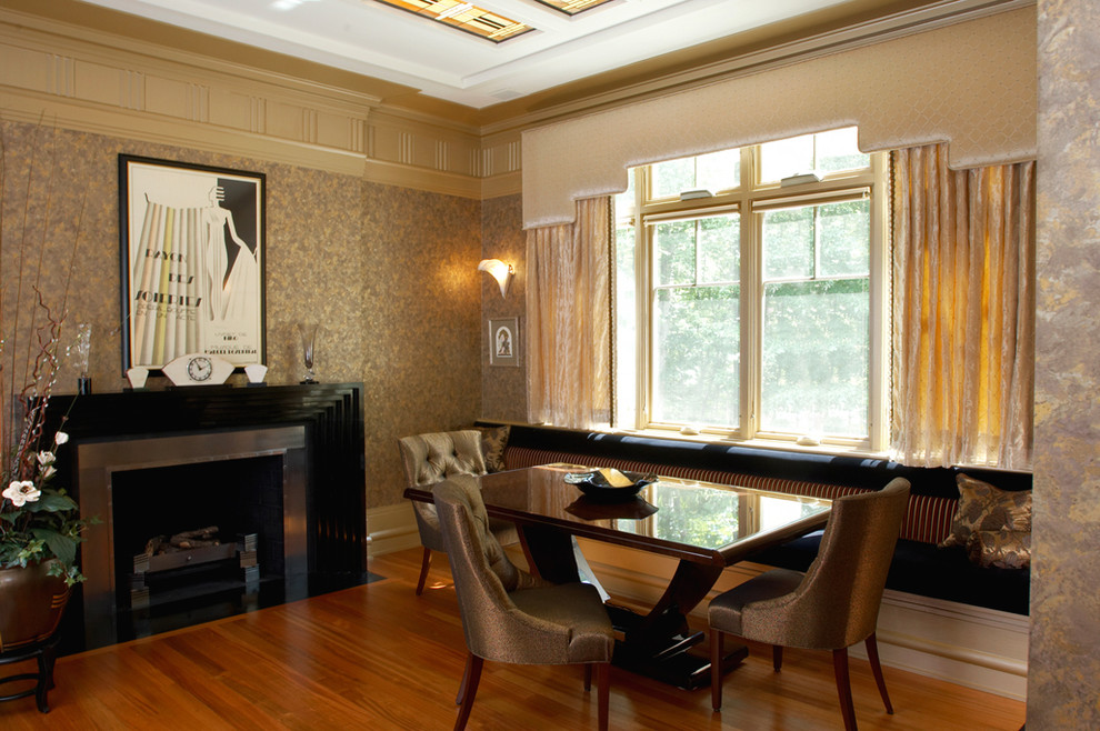 Photo of a large traditional separate dining room in DC Metro with multi-coloured walls, medium hardwood floors, a standard fireplace and a wood fireplace surround.