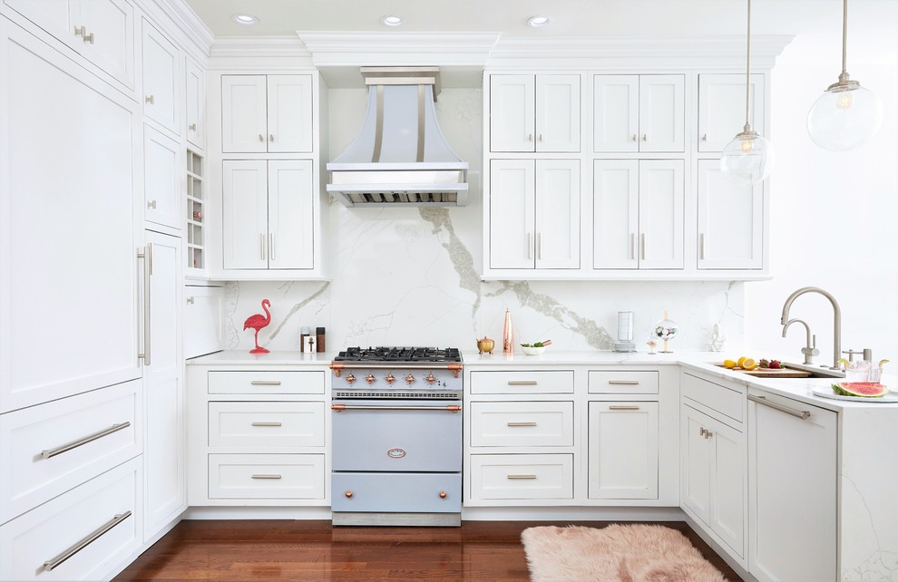 Mid-sized transitional u-shaped open plan kitchen in Philadelphia with a single-bowl sink, beaded inset cabinets, white cabinets, marble benchtops, white splashback, marble splashback, panelled appliances, medium hardwood floors, no island, beige floor and white benchtop.