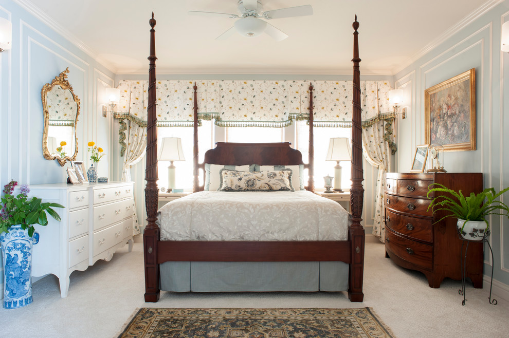 Photo of a mid-sized traditional master bedroom in Other with blue walls, carpet, no fireplace and white floor.