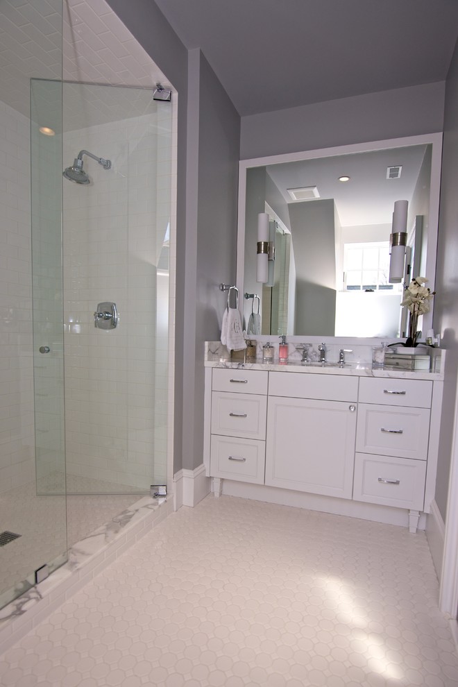 Inspiration for a transitional master white tile and subway tile mosaic tile floor bathroom remodel in St Louis with recessed-panel cabinets, gray cabinets, gray walls and an undermount sink
