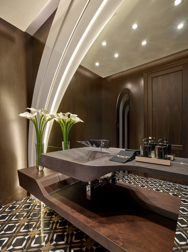 Design ideas for a contemporary powder room in Miami with brown walls, a wall-mount sink and multi-coloured floor.