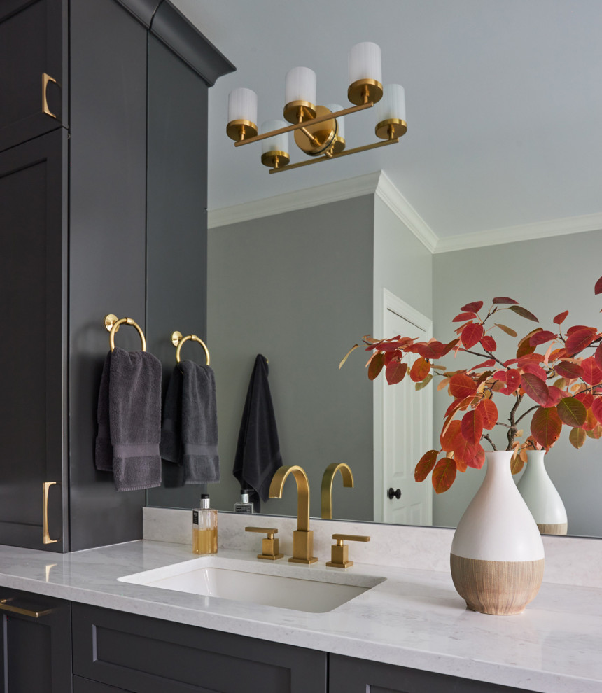 Example of a large transitional master double-sink freestanding bathtub design in Chicago with shaker cabinets, brown cabinets and an undermount sink