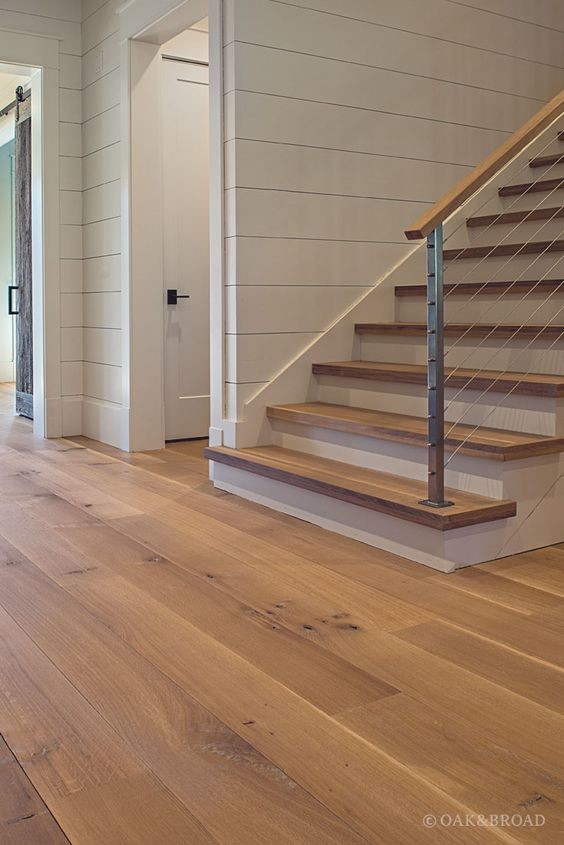 Inspiration for a mid-sized transitional wooden straight cable railing staircase remodel in Phoenix with painted risers