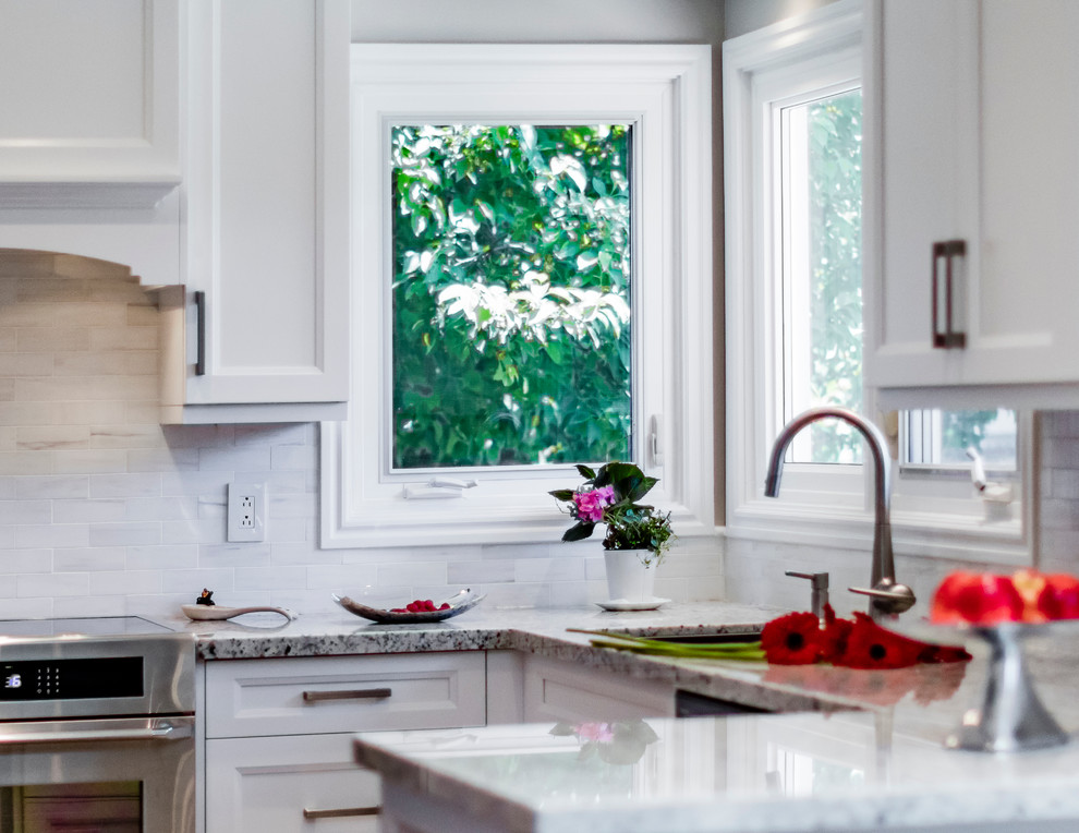 Example of a transitional kitchen design in Toronto