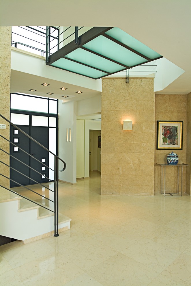 Photo of a modern entryway in Other with a double front door and a black front door.