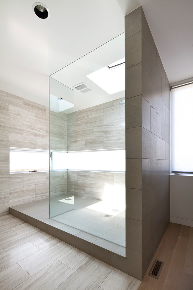 Inspiration for a large contemporary master bathroom in Los Angeles with an open shower, beige tile, an open shower, beige walls, porcelain floors and brown floor.