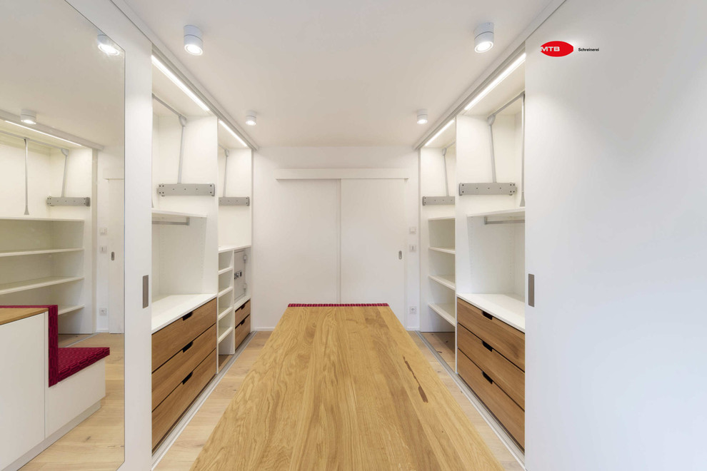 Design ideas for a large contemporary storage and wardrobe in Other.