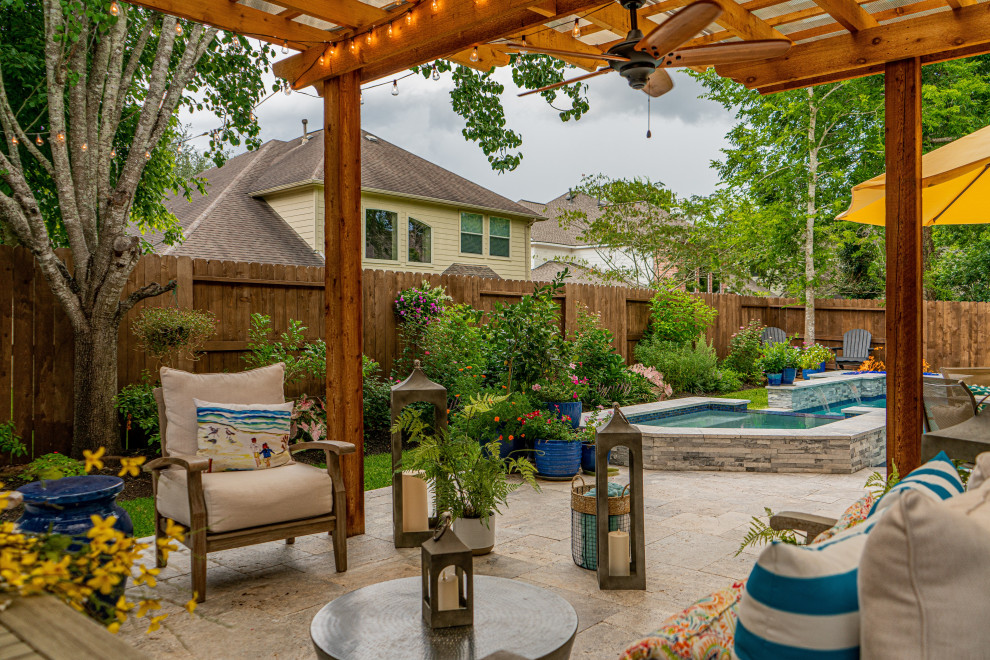Small cottage backyard custom-shaped pool photo in Houston with decking