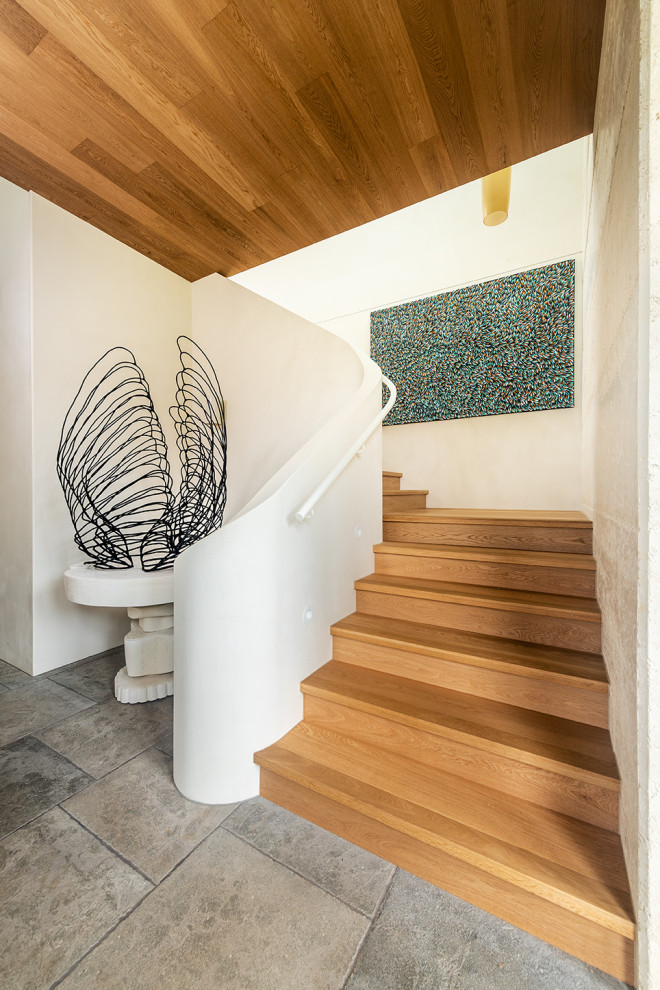 Gewendelte, Mittelgroße Moderne Holztreppe mit Holz-Setzstufen und Stahlgeländer in Melbourne