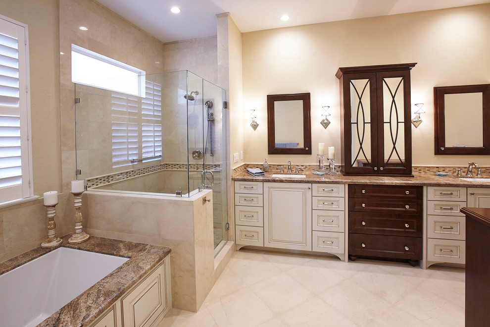Large elegant master beige tile, brown tile and glass tile porcelain tile and beige floor alcove shower photo in San Diego with raised-panel cabinets, white cabinets, an undermount tub, beige walls, an undermount sink, granite countertops and a hinged shower door