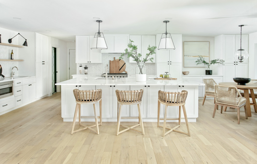Photo of an expansive beach style single-wall eat-in kitchen in Dallas with with island.