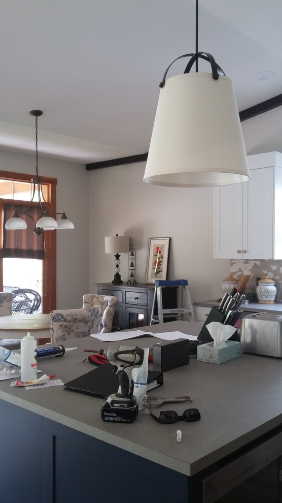 Inspiration for a craftsman vinyl floor and gray floor eat-in kitchen remodel with a drop-in sink, blue cabinets, laminate countertops, stainless steel appliances, gray countertops, shaker cabinets and an island