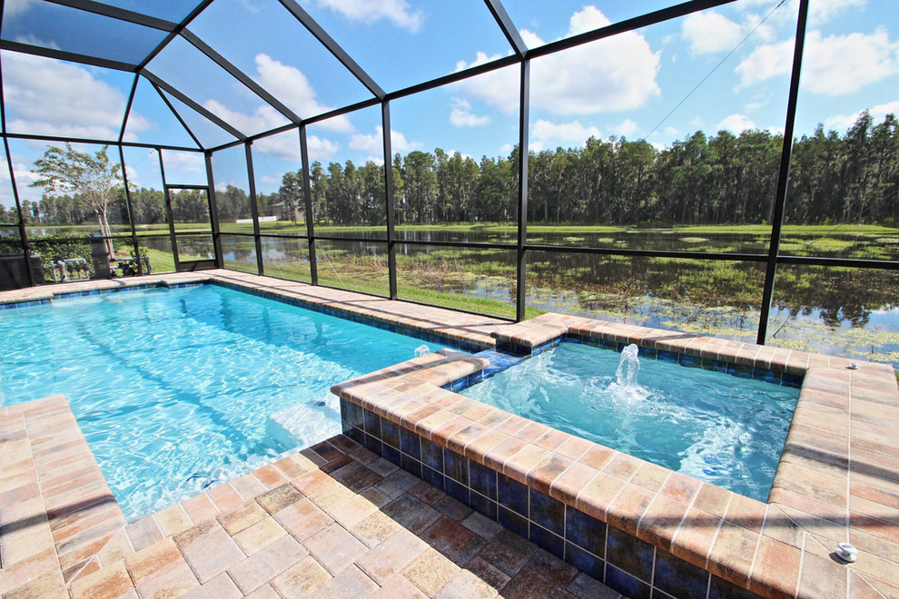 Transitional indoor pool photo in Tampa