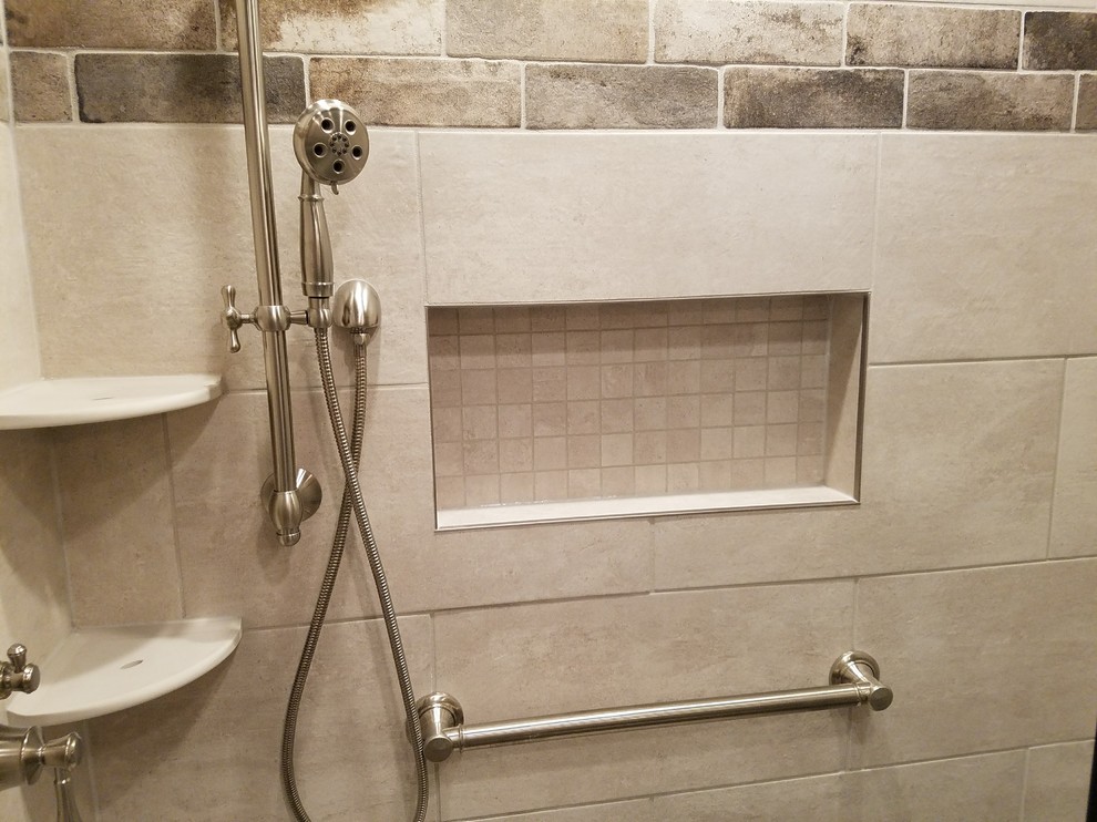 Small mountain style kids' gray tile and porcelain tile porcelain tile and gray floor alcove shower photo with furniture-like cabinets, distressed cabinets, a two-piece toilet, gray walls, an undermount sink, granite countertops and a hinged shower door