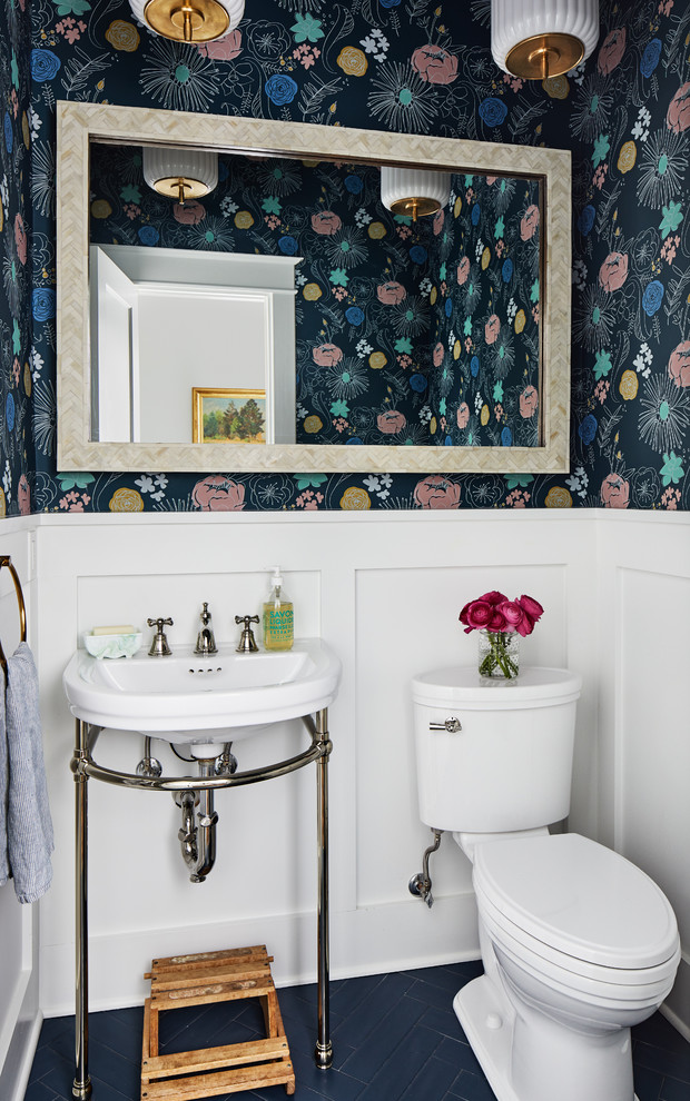 Beach style powder room in DC Metro with a two-piece toilet, multi-coloured walls, a console sink and blue floor.