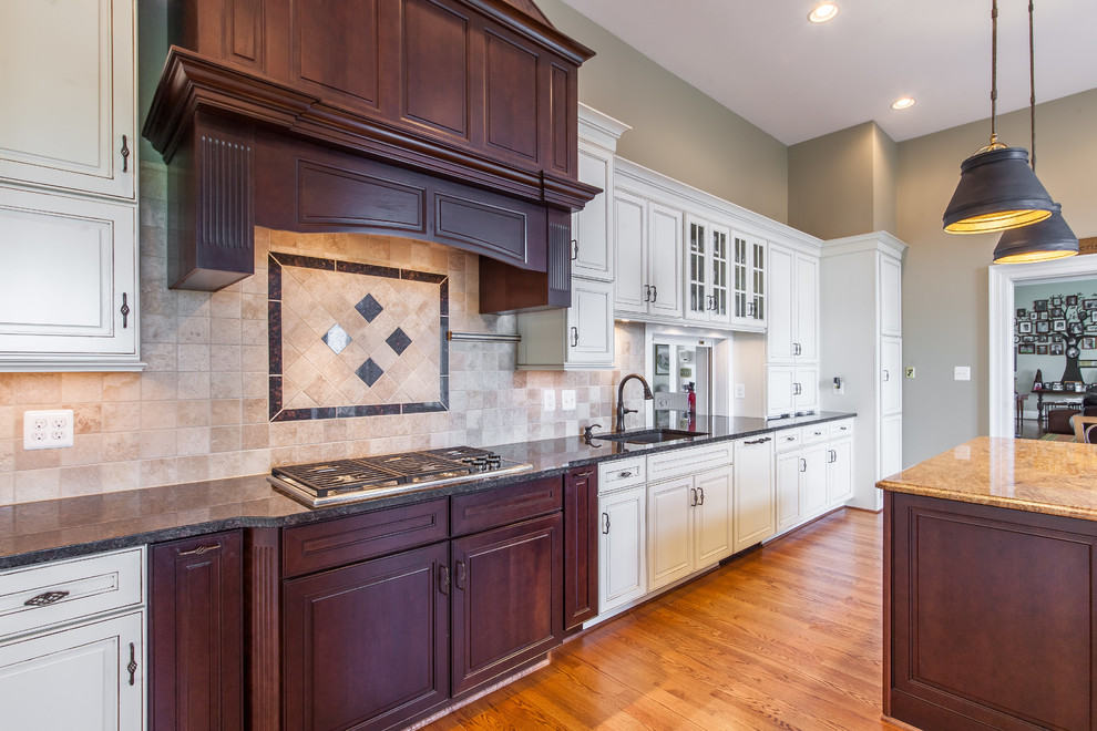 Example of a huge transitional medium tone wood floor eat-in kitchen design in DC Metro with raised-panel cabinets, granite countertops, stainless steel appliances and an island