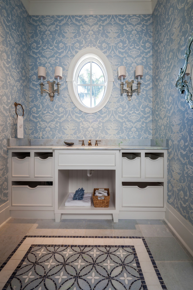 Inspiration for a traditional bathroom in Miami with open cabinets and grey cabinets.