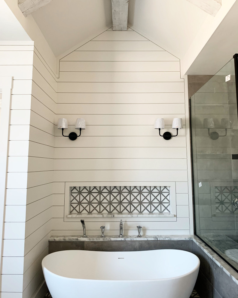 Example of a large country master double-sink, exposed beam and shiplap wall bathroom design in Dallas with white cabinets, a bidet, white walls, an integrated sink, granite countertops, a hinged shower door and a built-in vanity
