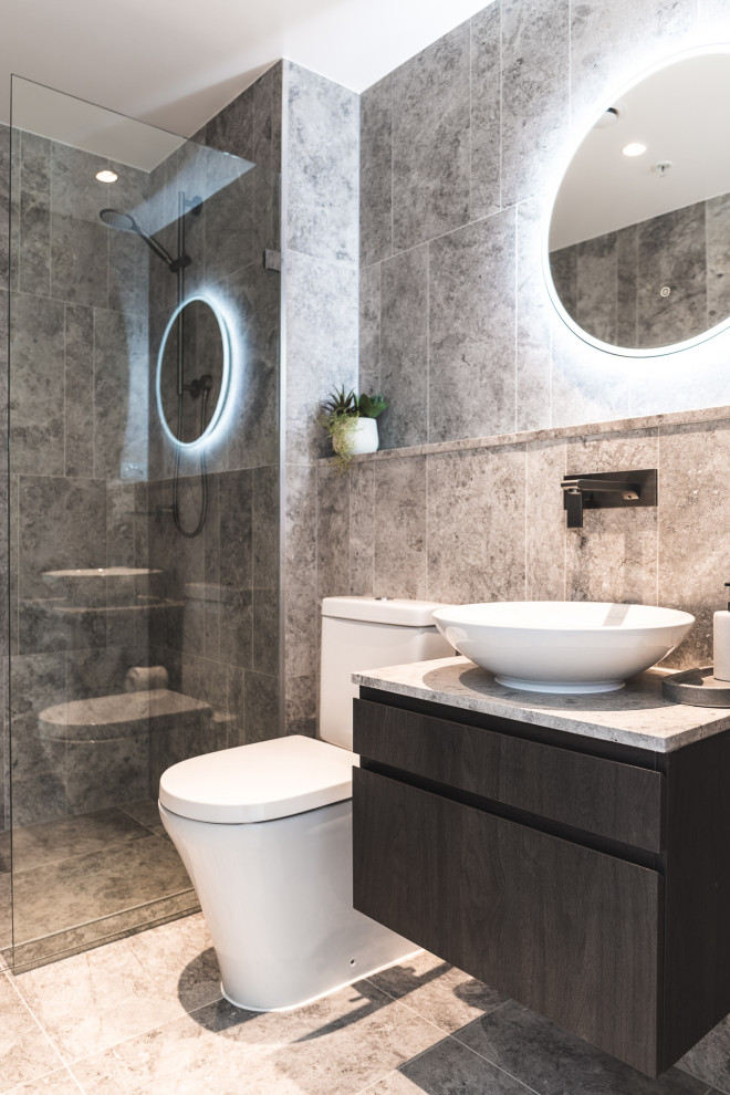Inspiration for a contemporary 3/4 bathroom in Sydney with flat-panel cabinets, grey cabinets, a curbless shower, gray tile, a vessel sink, grey floor, an open shower, grey benchtops, a single vanity and a floating vanity.