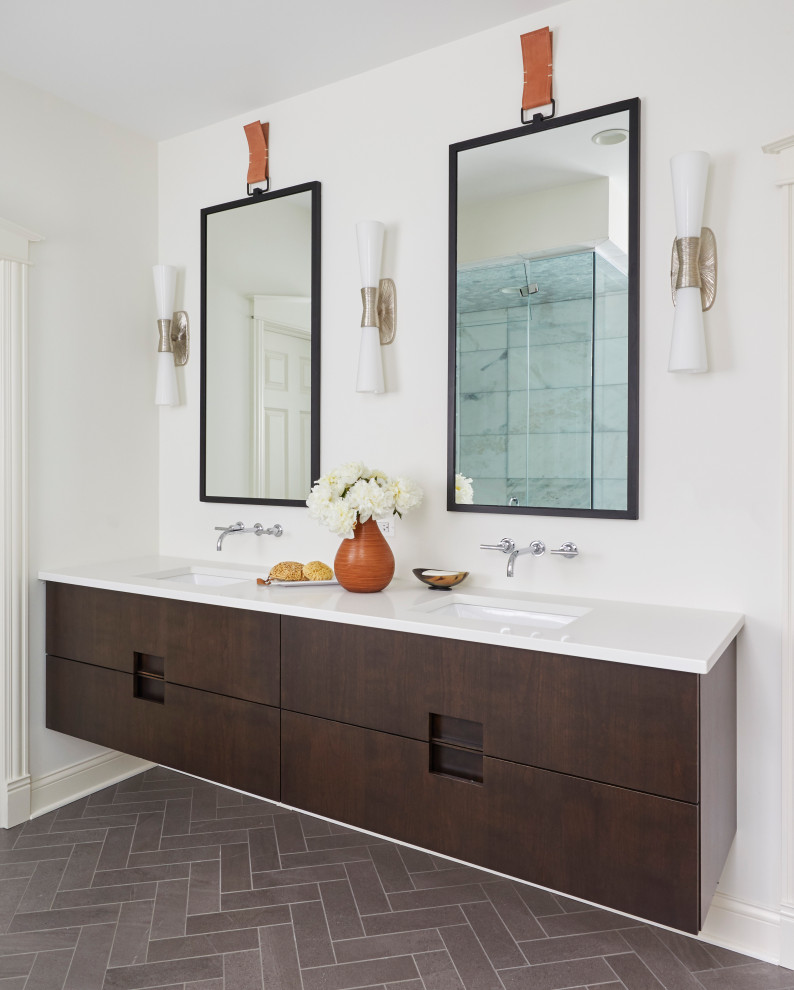 Photo of a mid-sized beach style master bathroom in Chicago with flat-panel cabinets, brown cabinets, a freestanding tub, an open shower, gray tile, marble, white walls, marble floors, a drop-in sink, engineered quartz benchtops, brown floor, a hinged shower door and white benchtops.