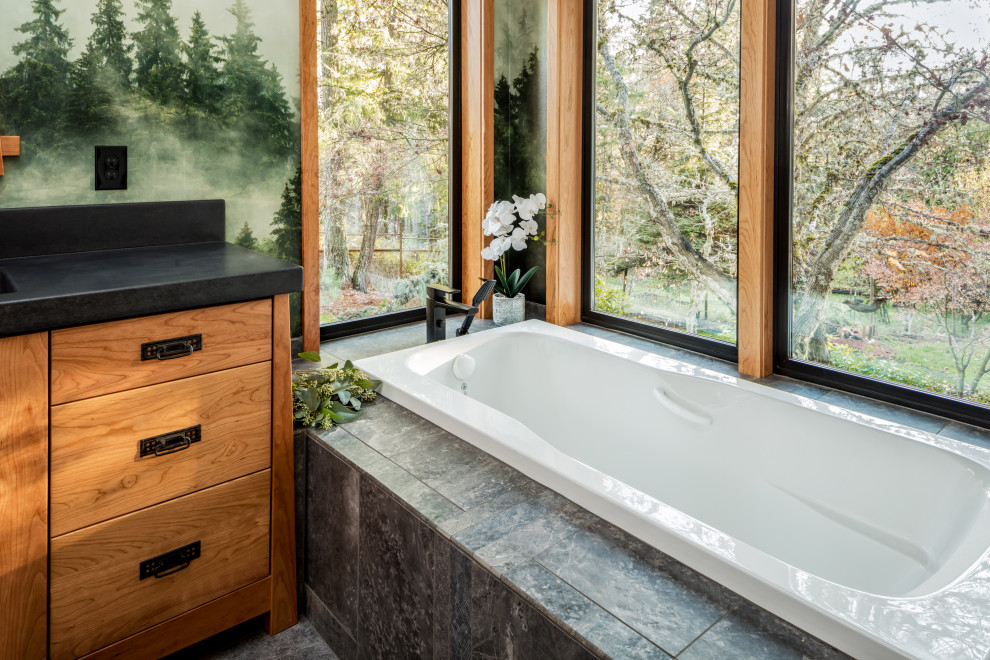 Photo of a medium sized world-inspired ensuite bathroom in Other with flat-panel cabinets, medium wood cabinets, a built-in bath, a built-in shower, porcelain flooring, an integrated sink, concrete worktops, grey floors, an open shower, double sinks, a built in vanity unit and wallpapered walls.