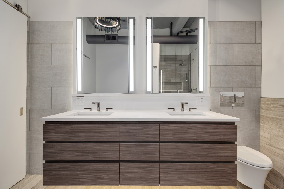 This is an example of an expansive transitional master bathroom in Chicago with furniture-like cabinets, grey cabinets, a freestanding tub, a corner shower, a wall-mount toilet, gray tile, marble, white walls, marble floors, an undermount sink, engineered quartz benchtops, grey floor, a hinged shower door, white benchtops, a niche, a double vanity, a floating vanity, exposed beam and planked wall panelling.