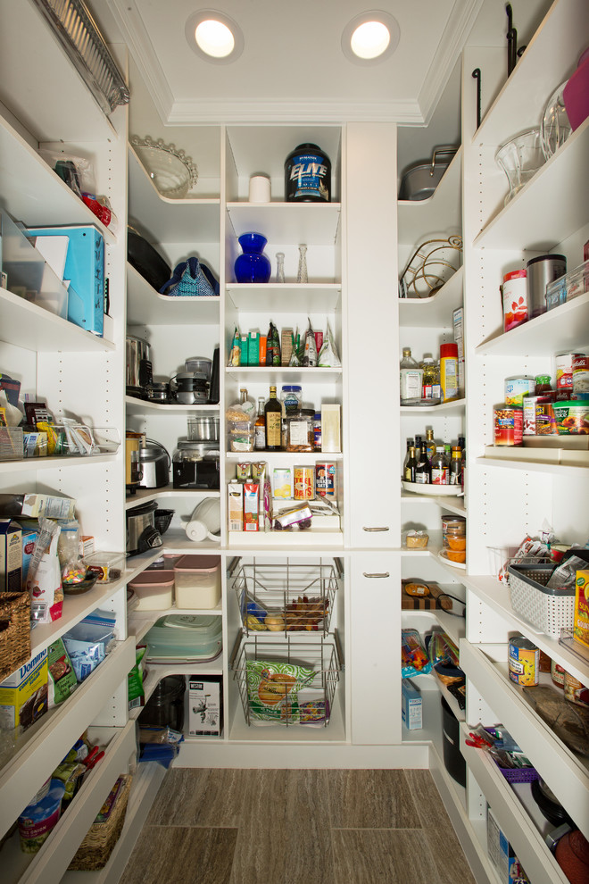 Photo of a small transitional u-shaped kitchen pantry in DC Metro with open cabinets, white cabinets, ceramic floors and no island.