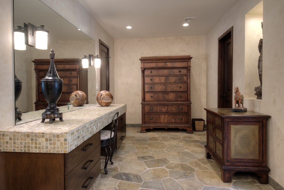 Large eclectic master bathroom in Orange County with a vessel sink, dark wood cabinets, tile benchtops, a freestanding tub, an alcove shower, multi-coloured tile, stone tile, beige walls and slate floors.