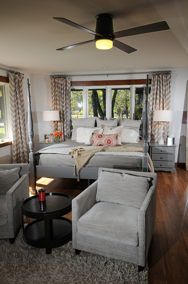 Example of a large transitional master dark wood floor and brown floor bedroom design with gray walls and no fireplace