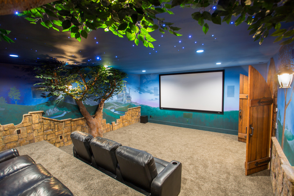 Photo of a mid-sized traditional enclosed home theatre in Salt Lake City with multi-coloured walls, carpet, a projector screen and beige floor.